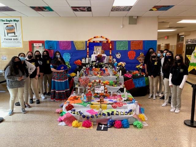 Students posing with the altar
